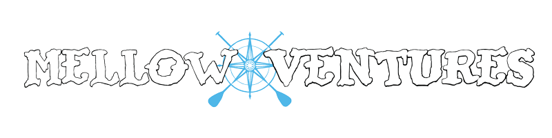 mellow ventures text with black outline with small blue compass rose in between words.
